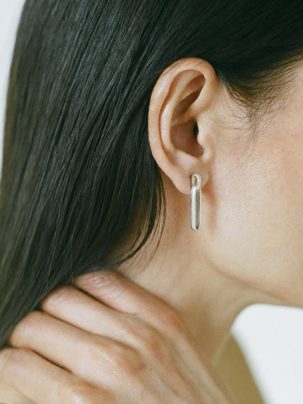 Model wearing Laura Lombardi Silver Chiusa Earrings