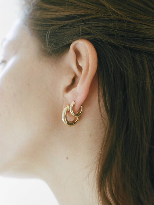 Model wearing Laura Lombardi Yellow Gold Mini Classica Hoops & Classica Hoops