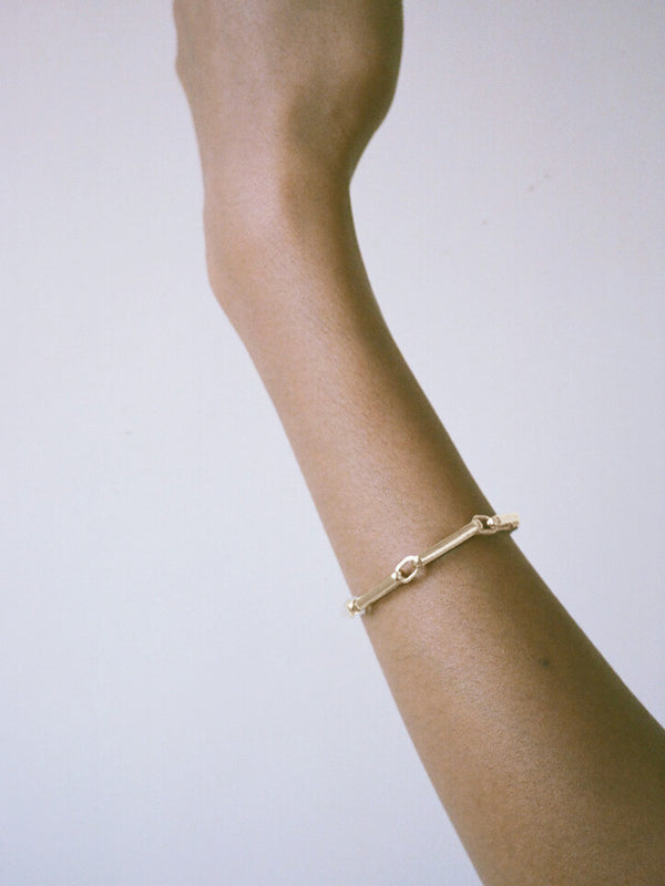 Model wearing Laura Lombardi gold Chiusa Bracelet