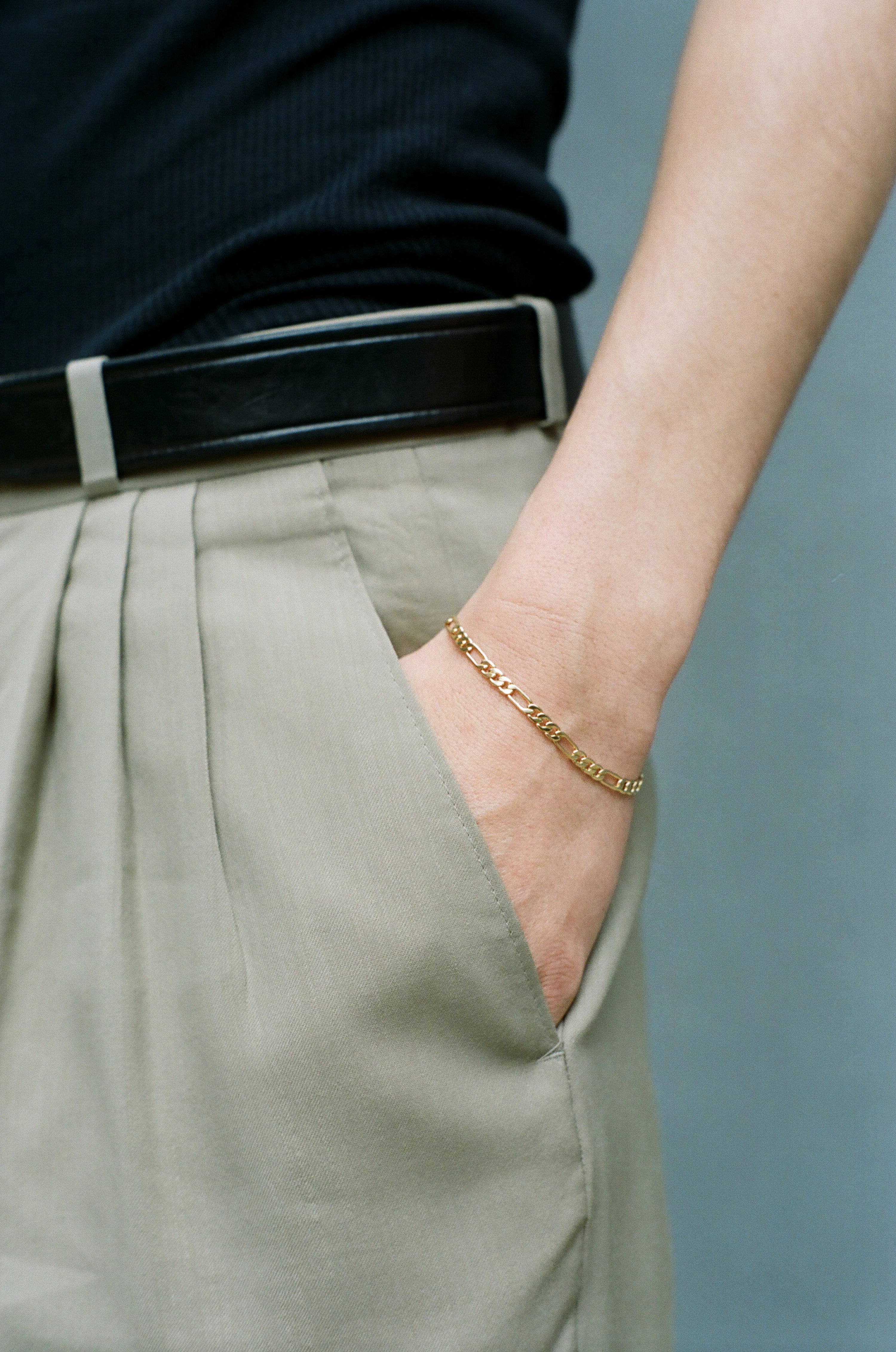 Model wearing Laura Lombardi gold Figaro Bracelet.