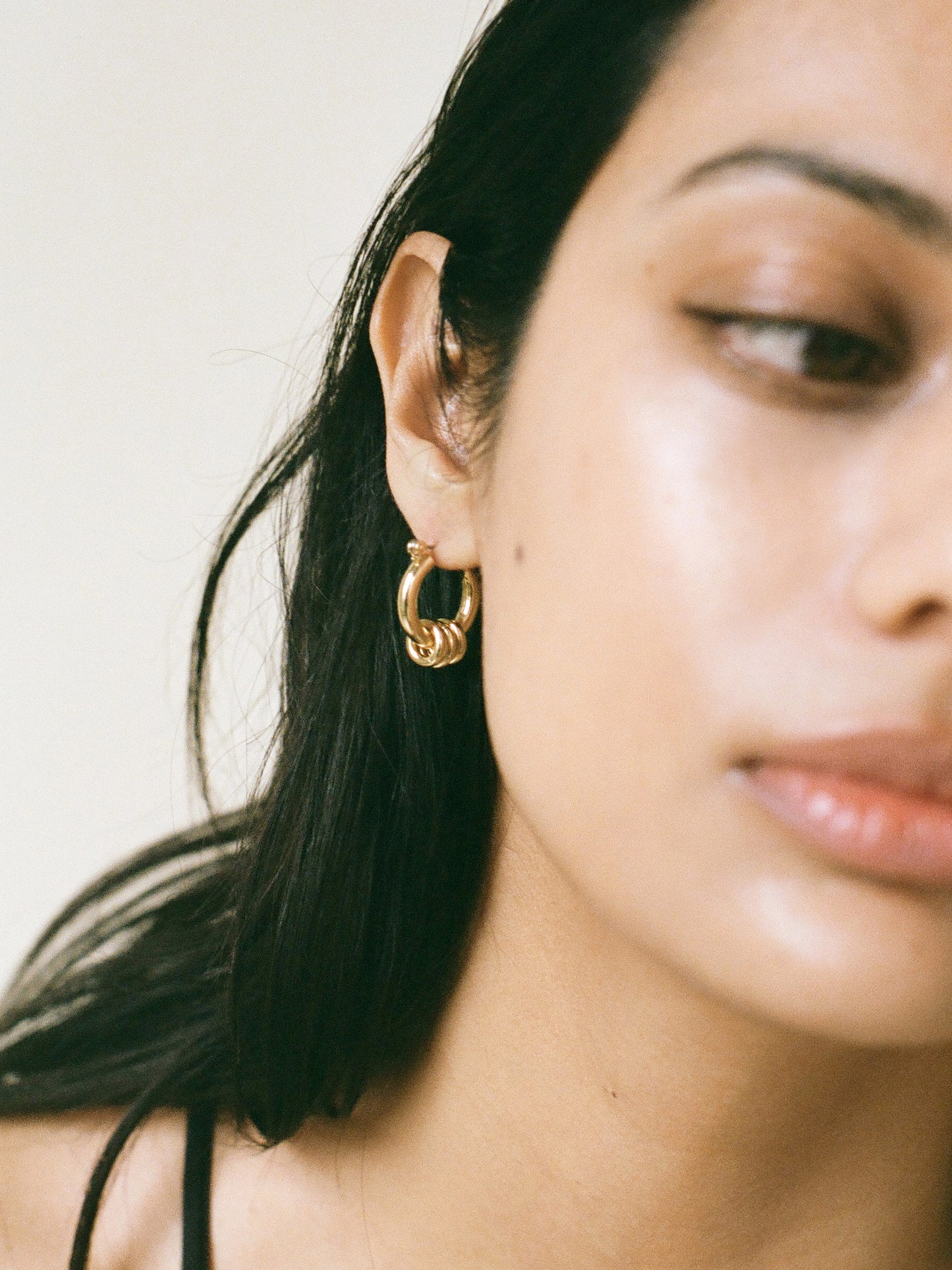 Model wearing Laura Lombardi gold Fillia Earrings