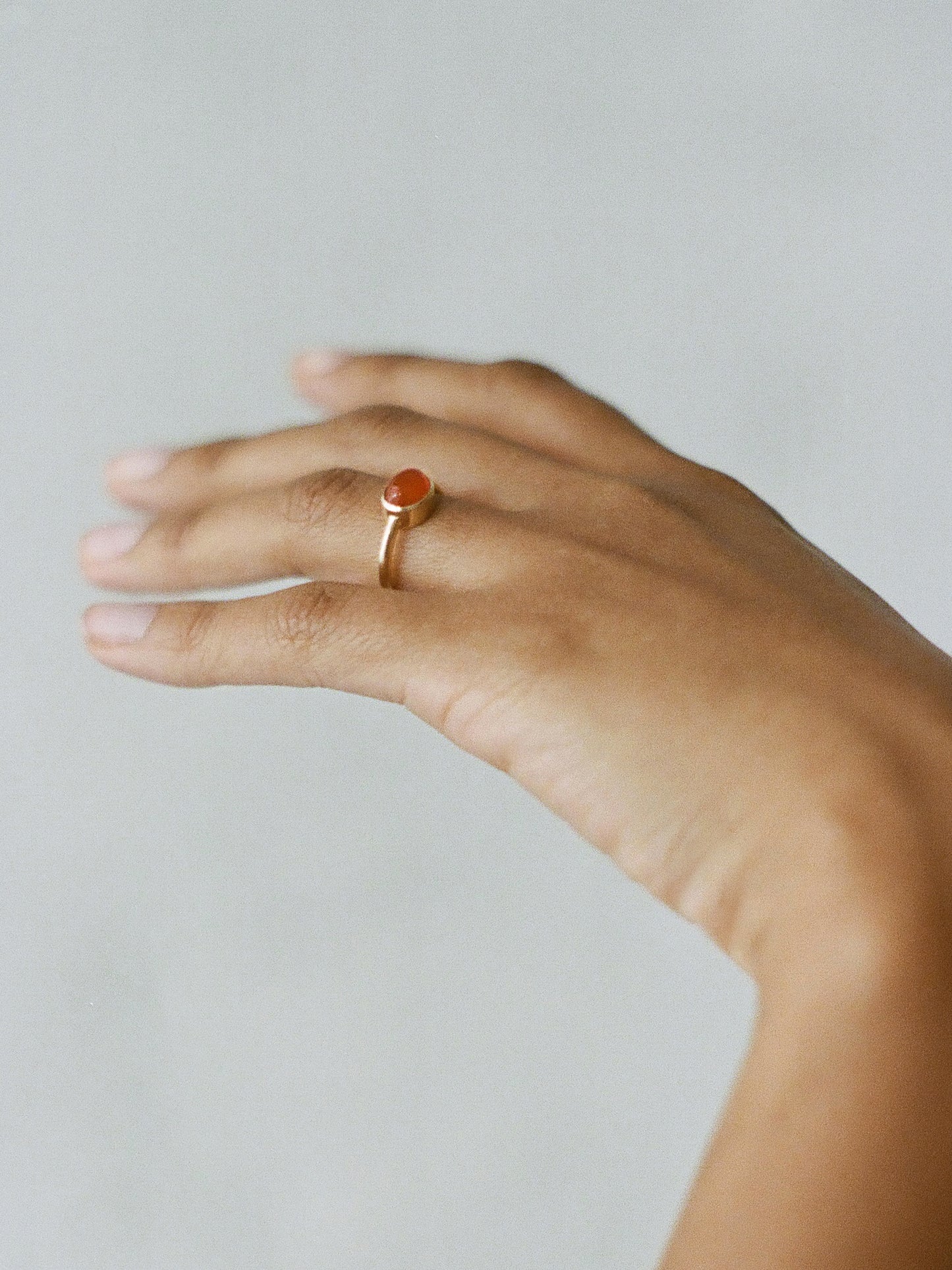 Model wearing Laura Lombardi yellow gold Goccia Ring