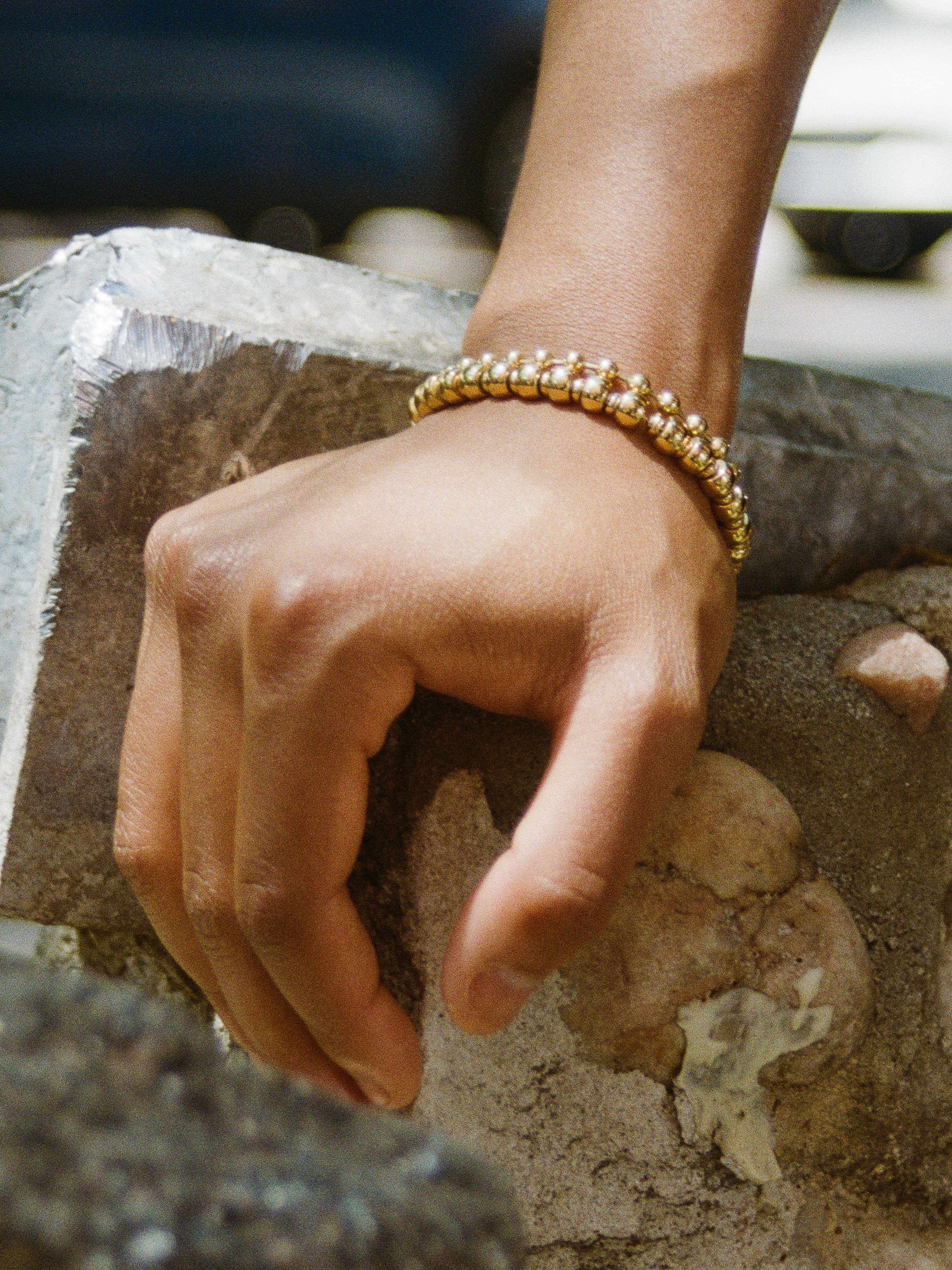 Model wearing Laura Lombardi Maremma Bracelet and Ball Chain Bracelet