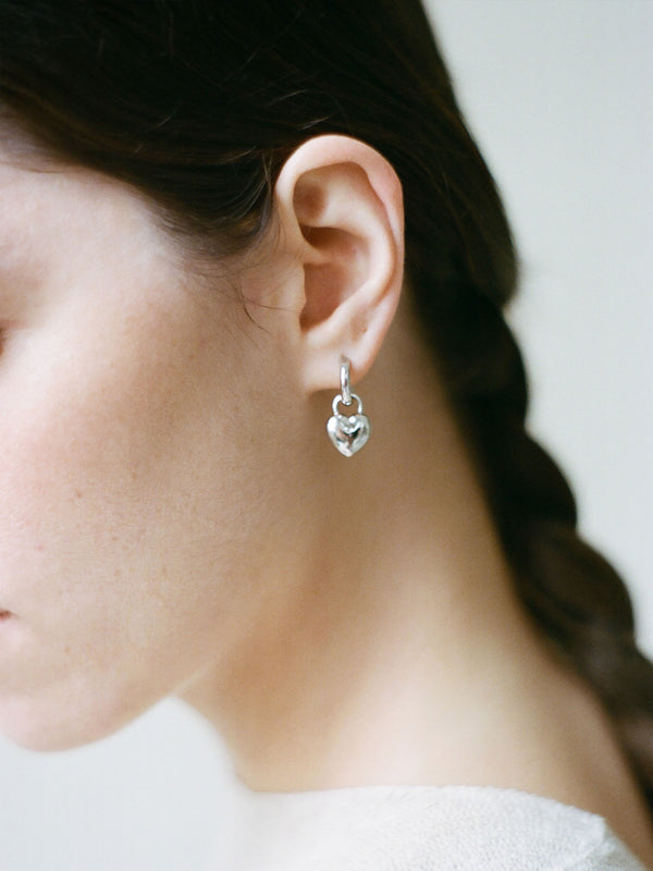 Model wearing Laura Lombardi Silver Mini Amorina Earrings