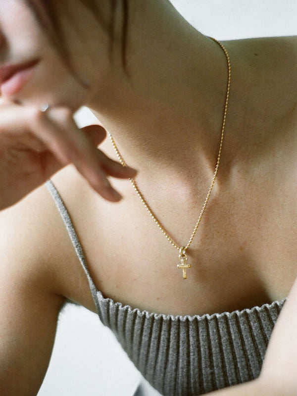 Model wearing Laura Lombardi gold Mini Cecilia Pendant