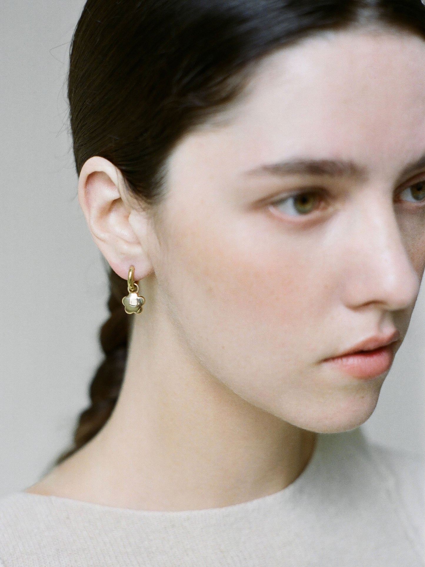 Model wearing Laura Lombardi gold Mini Fiorella Earrings