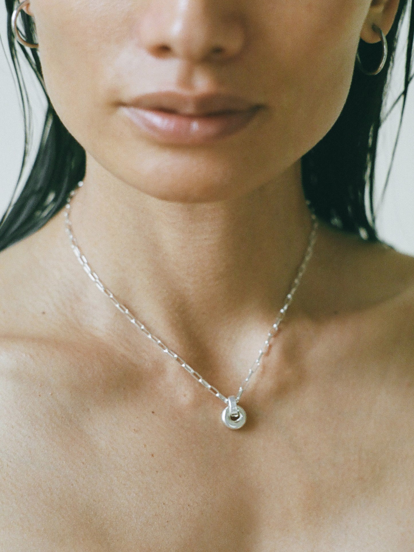 Model wearing Laura Lombardi Silver Mini Piega Pendant