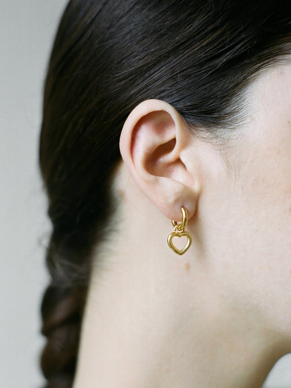 Model wearing Laura Lombardi gold Mini Teresa Earrings