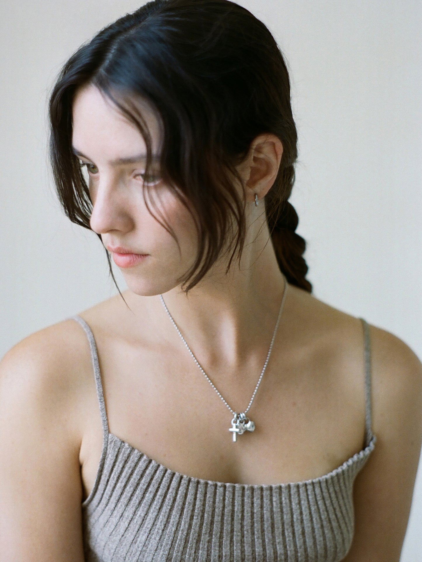 Model wearing Laura Lombardi Silver Multi Charm Pendant