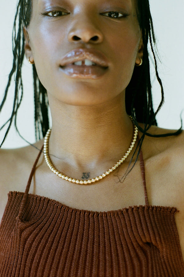 Model wearing Laura Lombardi gold Maremma Necklace