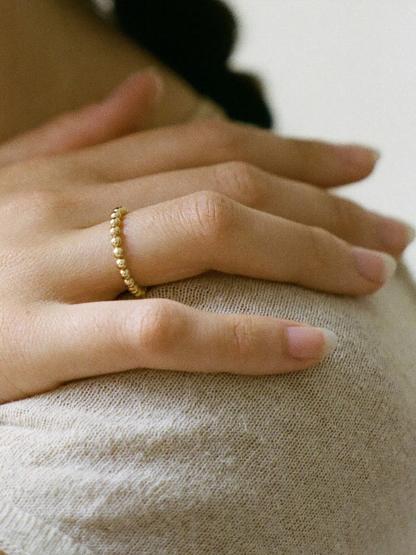 Model wearing Laura Lombardi gold Pallina Ring