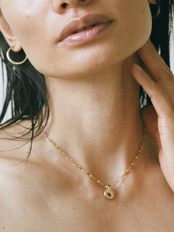 Model wearing Laura Lombardi gold Mini Piega Pendant