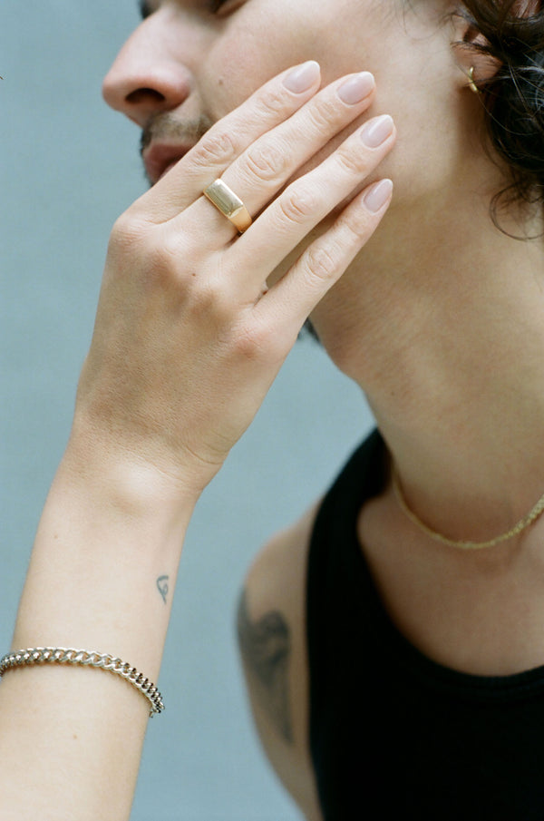 Model wearing Laura Lombardi gold Sigillo Ring.