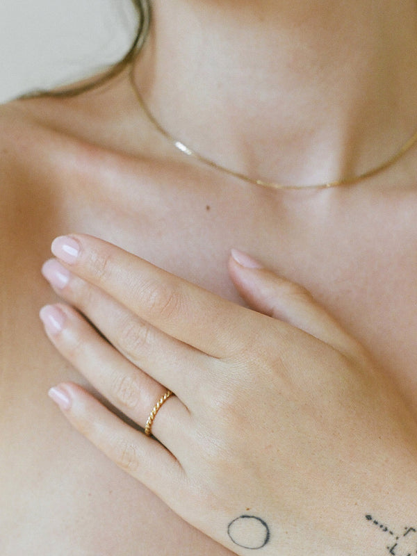 Model wearing Laura Lombardi Yellow Gold Twist Ring