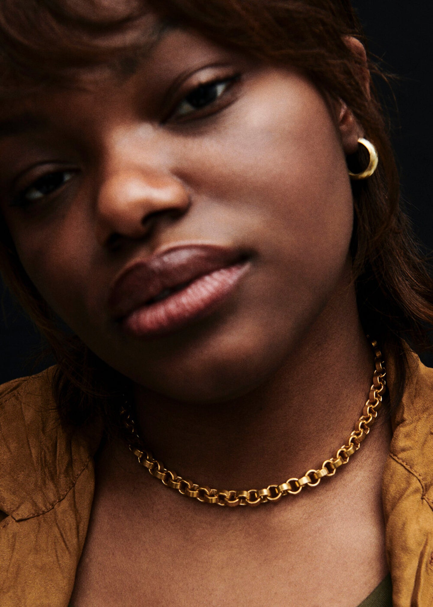 Model wearing Laura Lombardi gold Carla Chain and Mini Cusp Hoops.