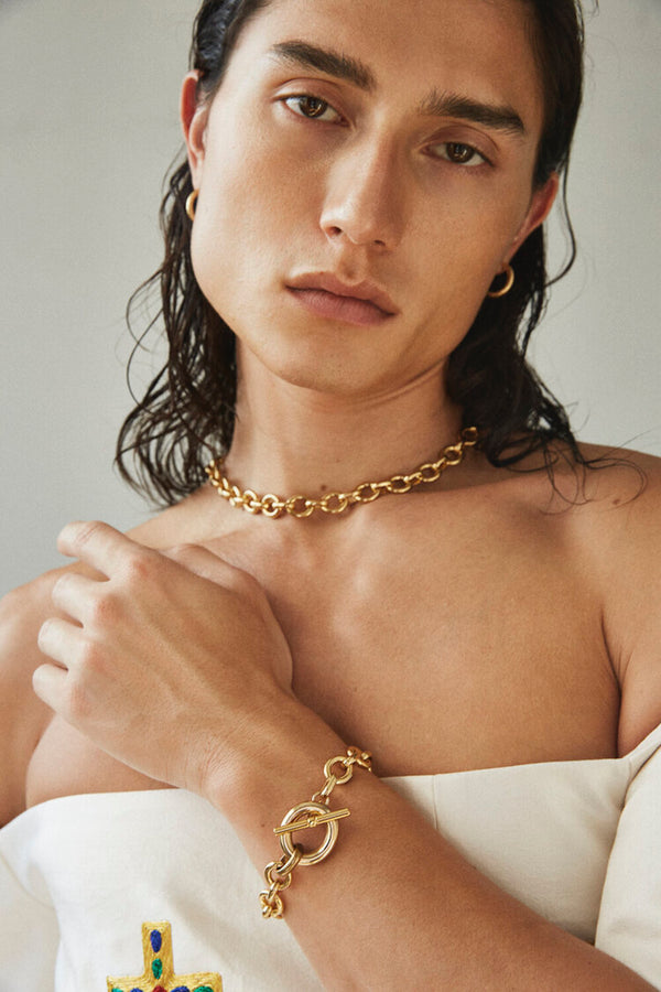 Model wearing Laura Lombardi gold Portrait Bracelet and Portrait Chain.