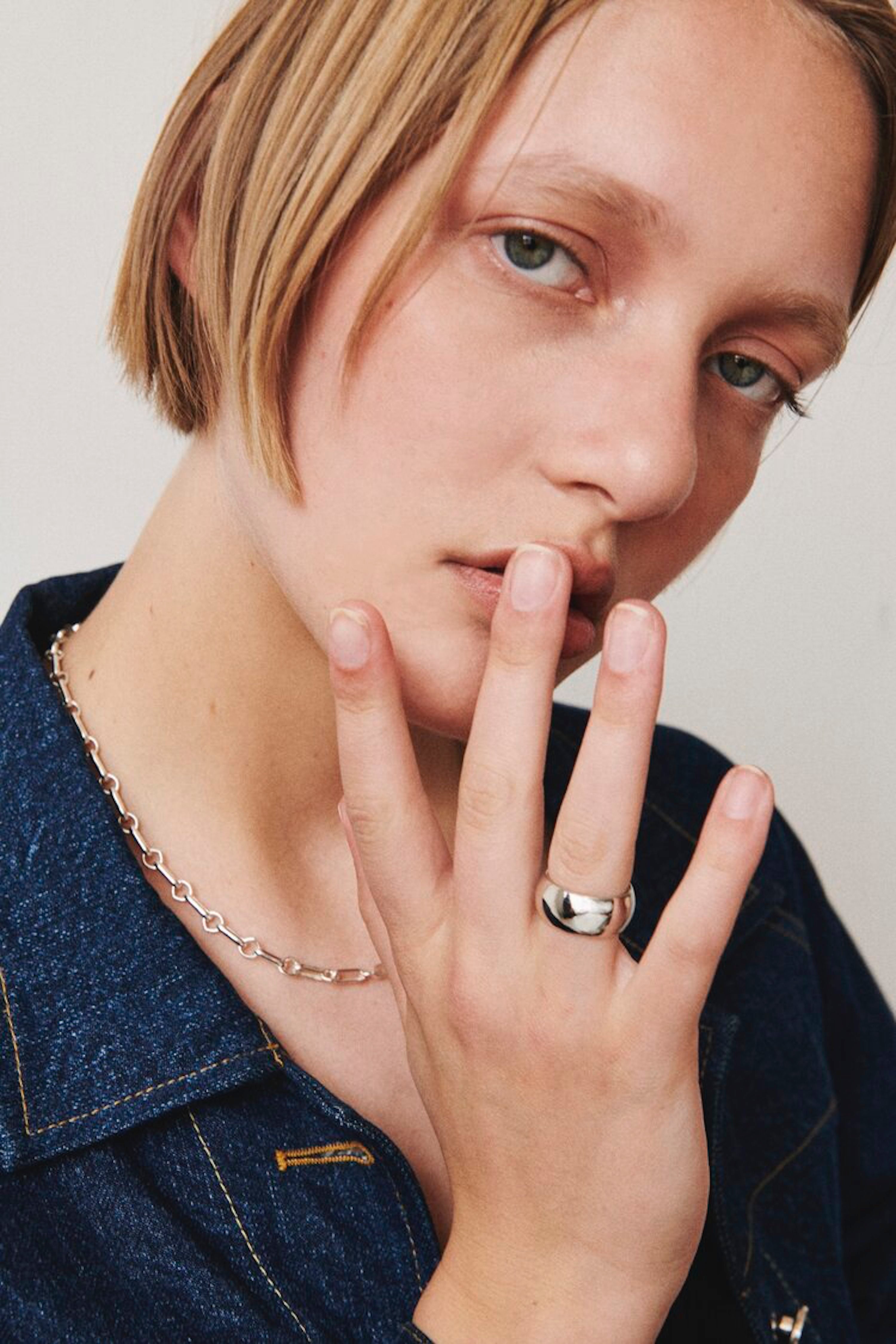 Model wearing Laura Lombardi Silver Bar Chain Necklace and Silver Luna Ring.