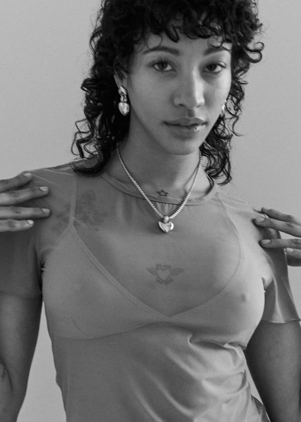 Model wearing Laura Lombardi Silver Chiara Pendant and Silver Chiara Earrings.